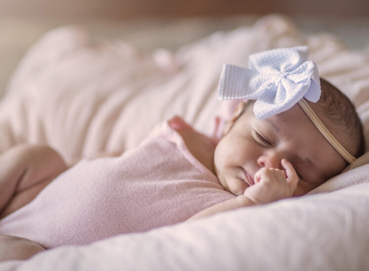 Baby girl sleeps during photos