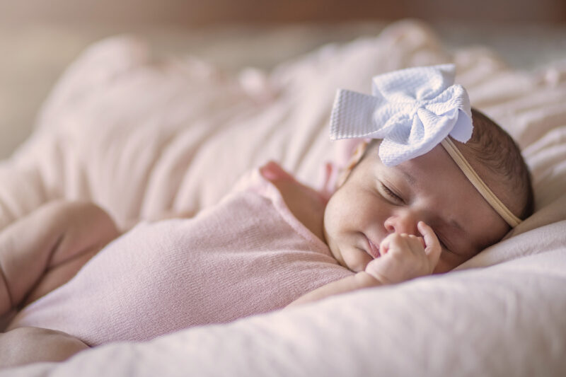Baby girl sleeps during photos
