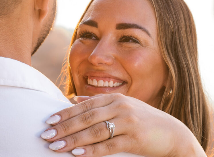 bride to be smiles at her fiancé