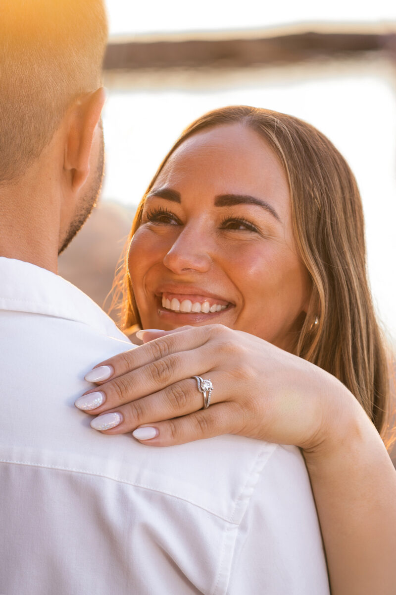 bride to be smiles at her fiancé