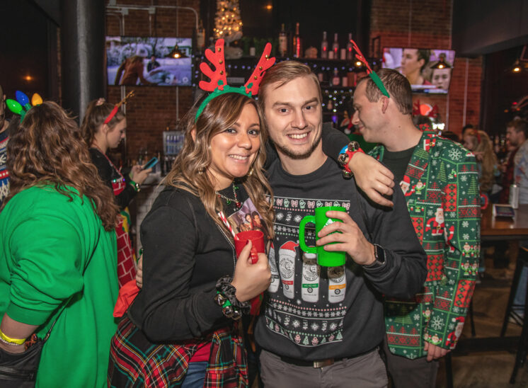 Christmas bar crawlers pose for photos