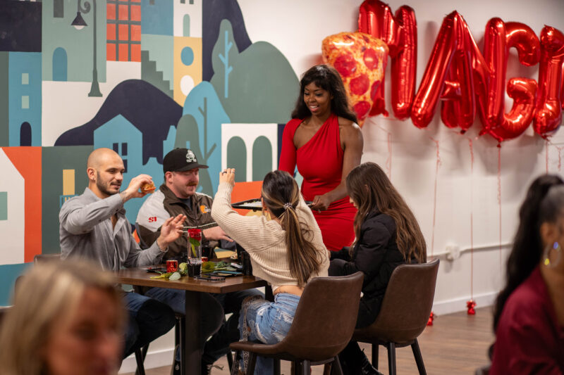 Diners reach for food at Cleveland party