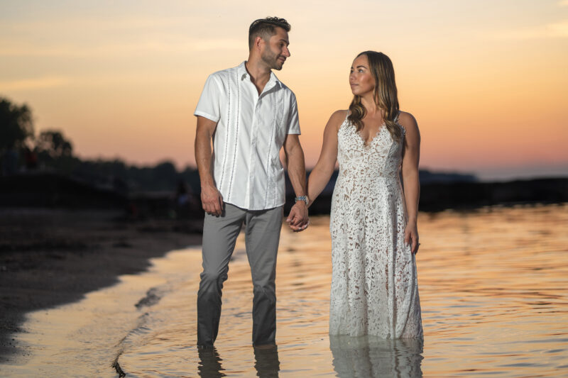 engaged couple walk during photoshoot