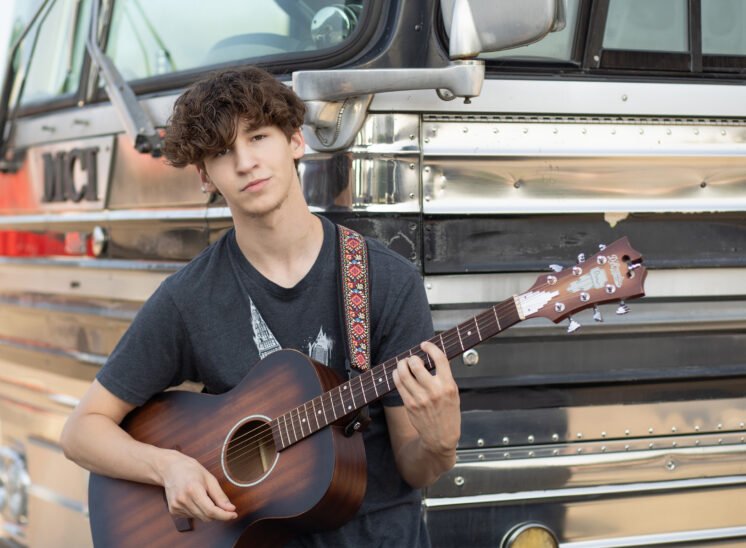 High school musician poses for photo