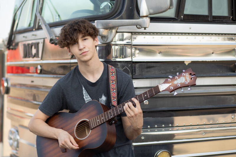 High school musician poses for photo