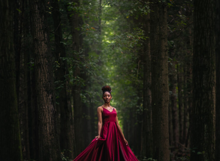 Model poses in pine trees