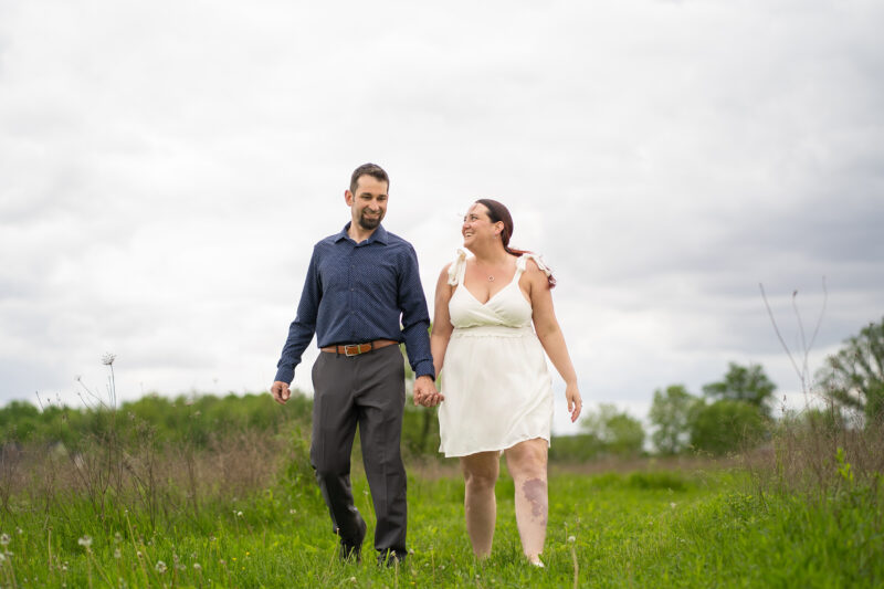 Newly married couple hold hands