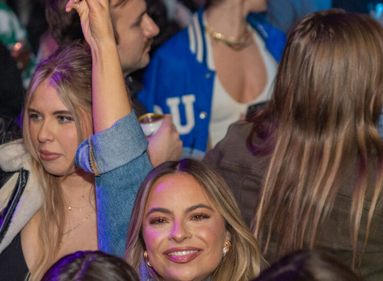 Woman flashes peace sign at Cleveland bar
