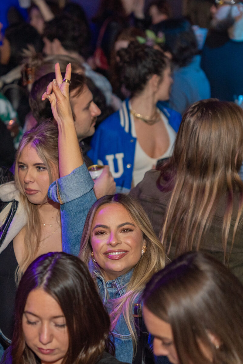 Woman flashes peace sign at Cleveland bar