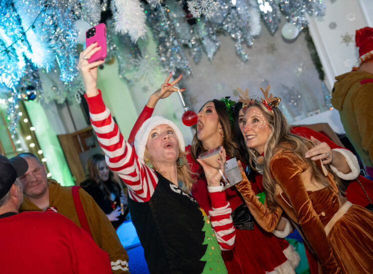 Women pose for photo at Cleveland party