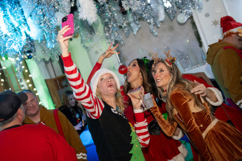 Women pose for photo at Cleveland party