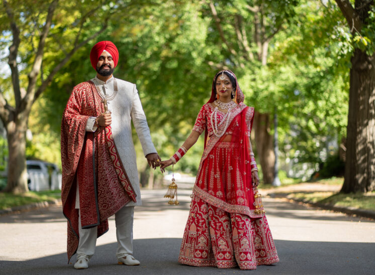 Bride and groom walk hand in hand