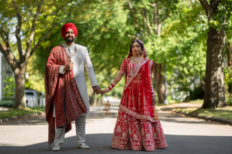 Bride and groom walk hand in hand