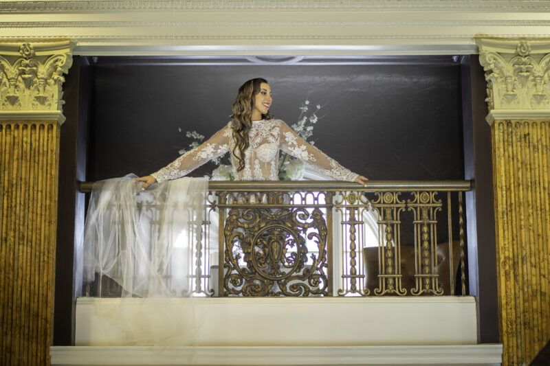 Bride-to-be looks from balcony at Cleveland photoshoot