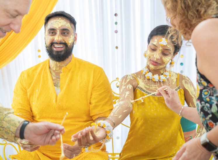 Newlyweds are painted in Indian wedding tradition