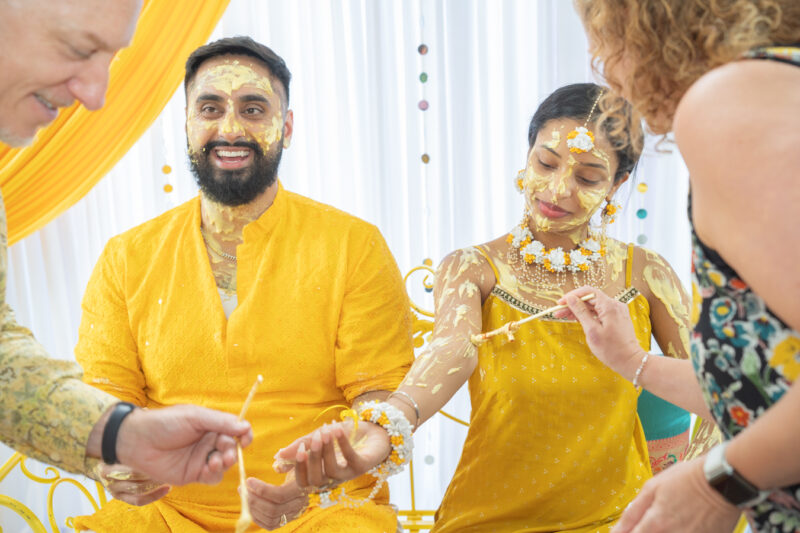 Newlyweds are painted in Indian wedding tradition