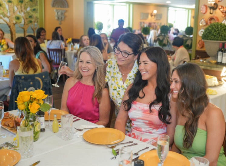 Cousin pose for photo at bridal shower